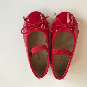 Red ballerina shoes.